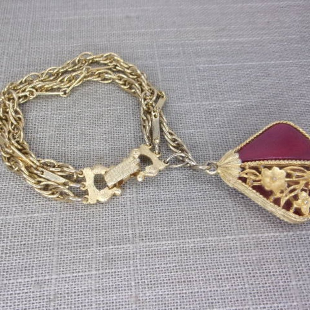 Red Charm Gold Tone Triple Strand Chain Bracelet